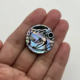 In hand, from Pokémon Coin Fan, full size