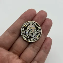 In hand, from Pokémon Coin Fan, full size