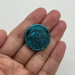 In hand, from Pokémon Coin Fan, full size