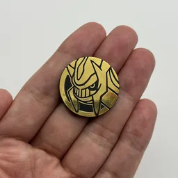 In hand, from Pokémon Coin Fan, full size