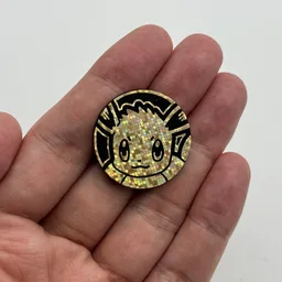 In hand, from Pokémon Coin Fan, full size