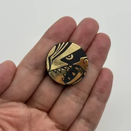 In hand, from Pokémon Coin Fan, full size