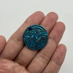 In hand, from Pokémon Coin Fan, full size