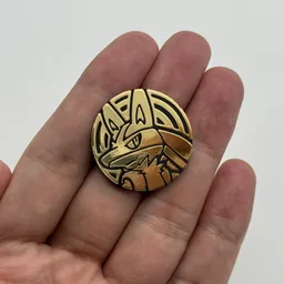 In hand, from Pokémon Coin Fan, full size