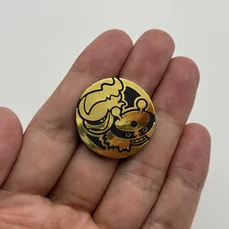 In hand, from Pokémon Coin Fan, full size