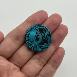 In hand, from Pokémon Coin Fan, full size