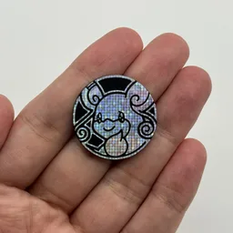 In hand, from Pokémon Coin Fan, full size