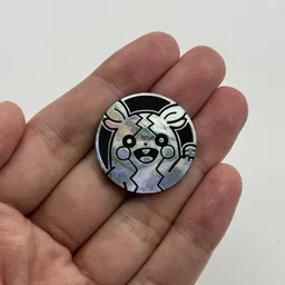 In hand, from Pokémon Coin Fan, full size