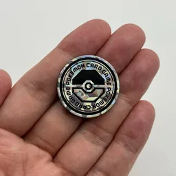 In hand, from Pokémon Coin Fan, full size