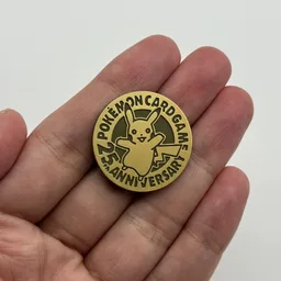 In hand, from Pokémon Coin Fan, full size