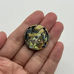 In hand, from Pokémon Coin Fan, full size