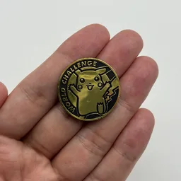 In hand, from Pokémon Coin Fan, full size