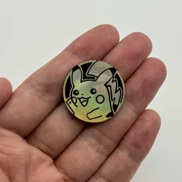 In hand, from Pokémon Coin Fan, full size