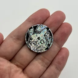 In hand, from Pokémon Coin Fan, full size