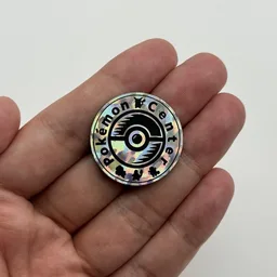 In hand, from Pokémon Coin Fan, full size