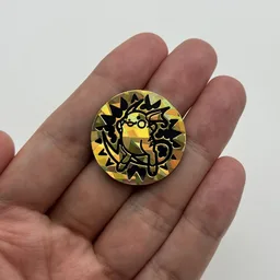 In hand, from Pokémon Coin Fan, full size