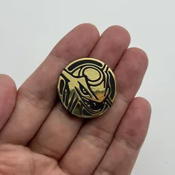In hand, from Pokémon Coin Fan, full size