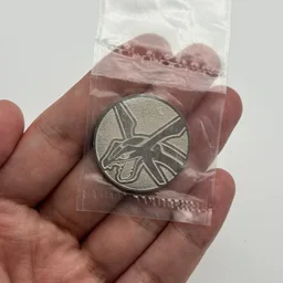 In hand, from Pokémon Coin Fan, full size