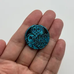 In hand, from Pokémon Coin Fan, full size
