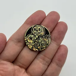 In hand, from Pokémon Coin Fan, full size
