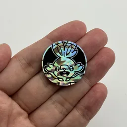 In hand, from Pokémon Coin Fan, full size
