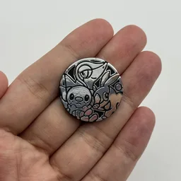 In hand, from Pokémon Coin Fan, full size