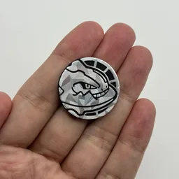 In hand, from Pokémon Coin Fan, full size