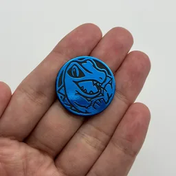In hand, from Pokémon Coin Fan, full size