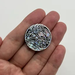 In hand, from Pokémon Coin Fan, full size