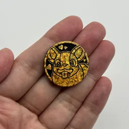 In hand, from Pokémon Coin Fan, full size