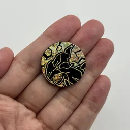In hand, from Pokémon Coin Fan, full size