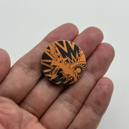 In hand, from Pokémon Coin Fan, full size