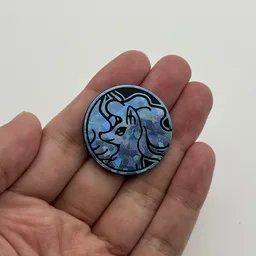 In hand, from Pokémon Coin Fan, full size