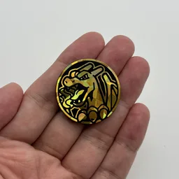 In hand, from Pokémon Coin Fan, full size