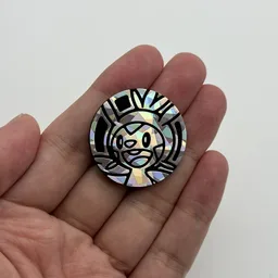 In hand, from Pokémon Coin Fan, full size