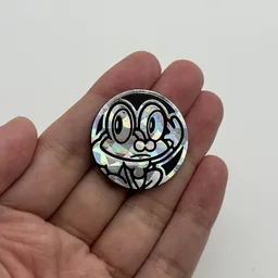 In hand, from Pokémon Coin Fan, full size
