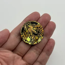 In hand, from Pokémon Coin Fan, full size