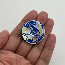 In hand, from Pokémon Coin Fan, full size