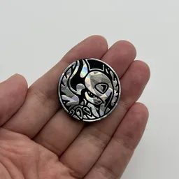 In hand, from Pokémon Coin Fan, full size