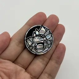 In hand, from Pokémon Coin Fan, full size
