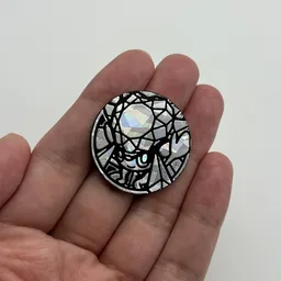 In hand, from Pokémon Coin Fan, full size