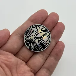 In hand, from Pokémon Coin Fan, full size