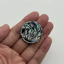 In hand, from Pokémon Coin Fan, full size