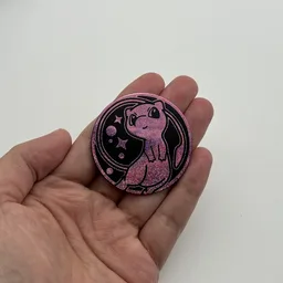 In hand, from Pokémon Coin Fan, full size