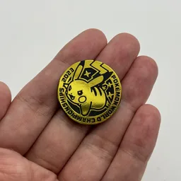 In hand, from Pokémon Coin Fan, full size