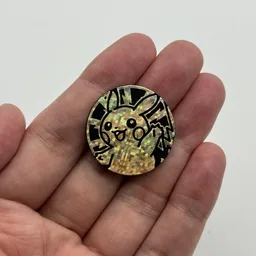 In hand, from Pokémon Coin Fan, full size
