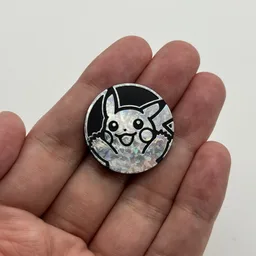 In hand, from Pokémon Coin Fan, full size