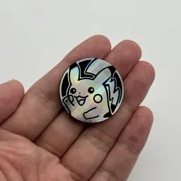 In hand, from Pokémon Coin Fan, full size
