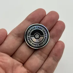 In hand, from Pokémon Coin Fan, full size