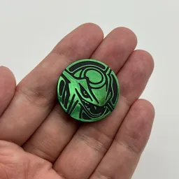 In hand, from Pokémon Coin Fan, full size